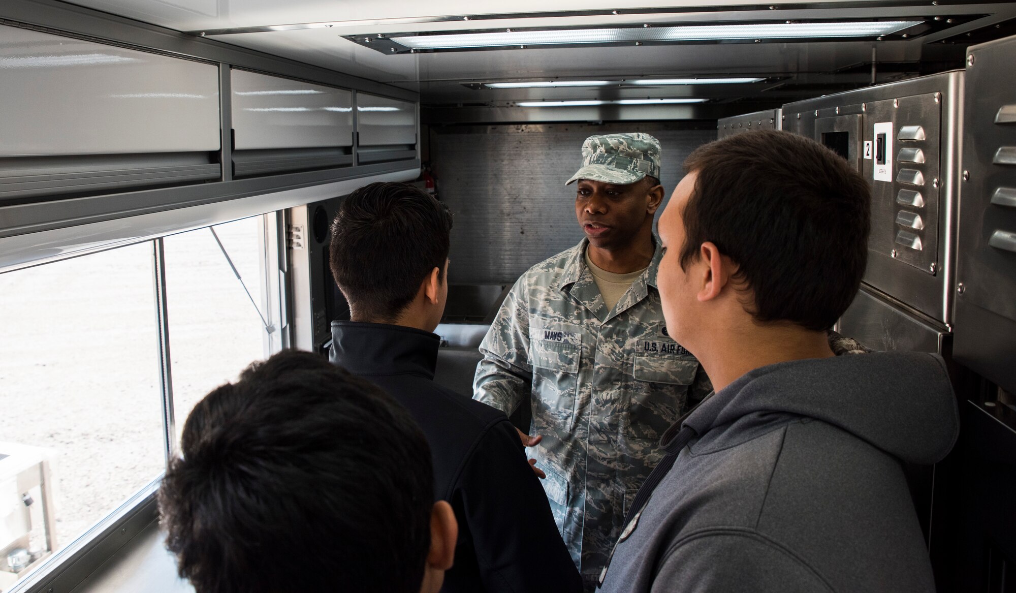 Master Sgt. Brian Mays, 188th Force Support Squadron sustainment services superintendent, speaks to students of Northside and Southside public schools about the Disaster Relief Mobile Kitchen Trailer Jan. 25, 2016, during their visit of the 188th Wing at Ebbing Air National Guard Base, Fort Smith Ark. The students are members of the Northside junior reserve officer training corps (JROTC) program and came to the 188th to learn about careers in the Air National Guard. (U.S. Air National Guard photo by Senior Airman Cody Martin/Released)