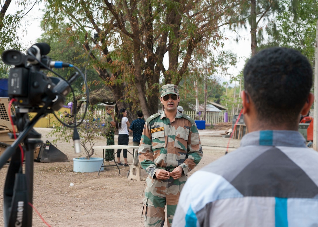 Indian Army Maj. Kuldeet Gautam, Bengal Engineering Group and Center, Corps of Engineers, Indian Army, is interviewed during the Ban Raj Bum Roong school construction project Jan. 30 at Lamsonthi, Kuttaphet, Thailand. The construction at Ban Raj Bum Roong is one of six HCA sites in which the Thai, U.S. and partner nation’s militaries will work together on civic programs during Cobra Gold 2016. Cobra Gold, in its 35th iteration, demonstrates the commitment of the Kingdom of Thailand and the U.S. to our long-standing alliance and regional partnership toward advancing prosperity and security in the Asia-Pacific region.  (U.S. Marine Corps photo by Staff Sgt. Jose O. Nava/Released)