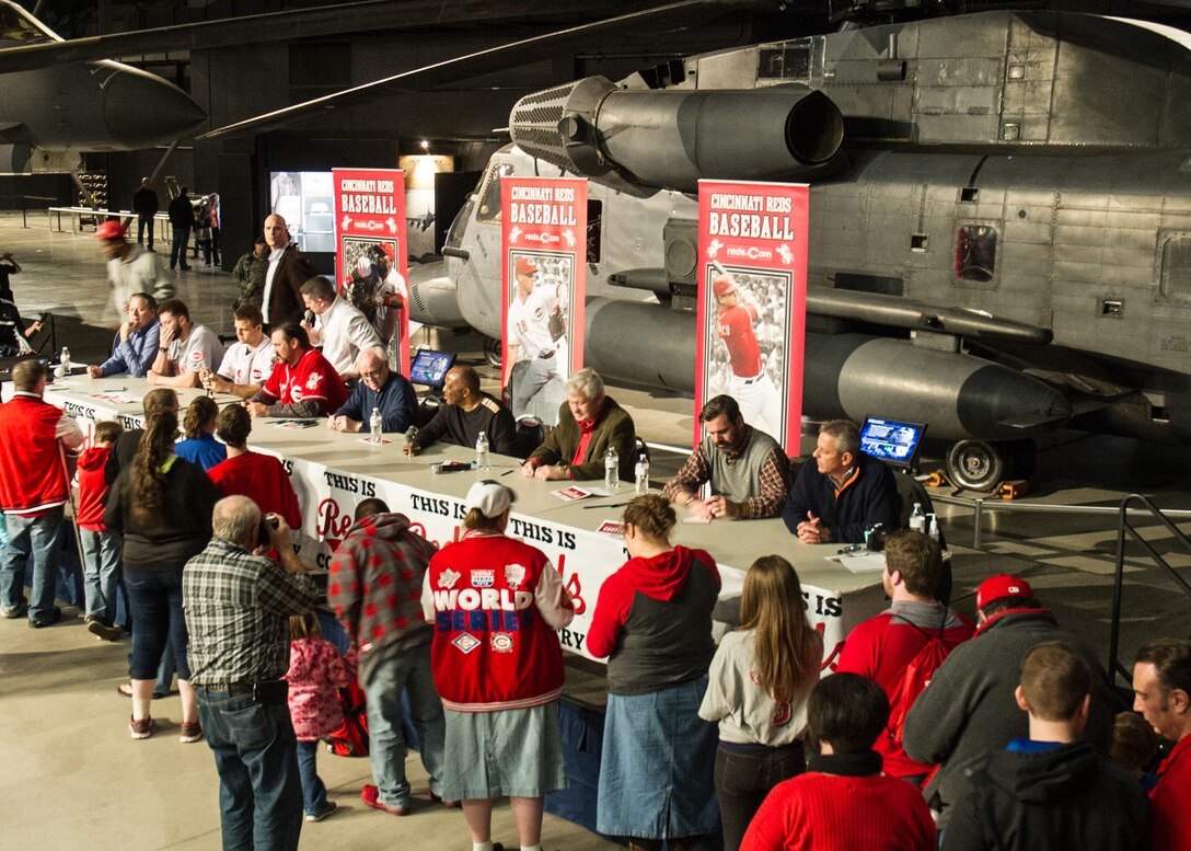 National Museum of the U.S. Air Force visitors had the opportunity to meet members of the Cincinnati Reds organization on January 30th, 2016. Catcher Devin Mesoraco; president of baseball operations Walt Jocketty; minor league pitcher Cody Reed; former catcher Corky Miller; owner Bob Castellini; chief operating officer Phil Castellini; Baseball Hall of Famer Joe Morgan; broadcasters Thom Brennaman and Jim Day and mascot Mr. Redlegs at the museum stop. (U.S. Air Force photo) 