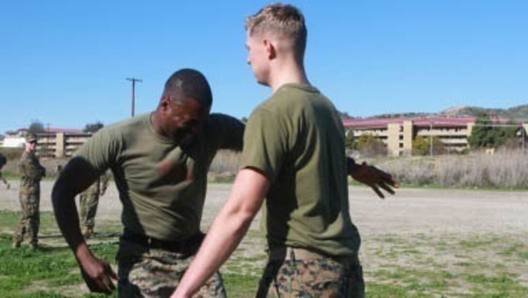 First Sgt. Shonor Burton runs through a non-lethal weapons course while blinded by the effects of oleoresin capsicum (OC) spray, Jan. 26, 2016. Burton is the company first sergeant for Company B, 1st Combat Engineer Battalion, 1st Marine Division, I Marine Expeditionary Force at Marine Corps Base Camp Pendleton, California. 