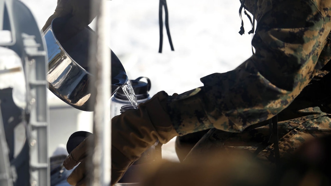 A Marine with Combat Logistics Battalion 252 pours purified water into a bottle in the mountains of Bridgeport, California, during Mountain Exercise 1-16, a cold weather training exercise, on Jan. 12, 2016. The training is a prerequisite for a large, multi-national exercise called Cold Response 16 that will take place in Norway, March of this year. Cold Response will challenge 12 NATO allies’ and partners’ abilities to work together and respond in the case of a crisis. 