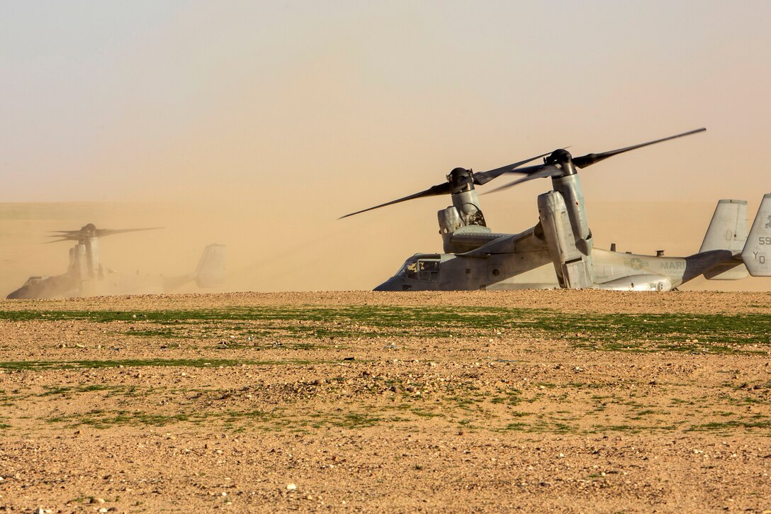 Two Marine Corps MV-22 Ospreys sit on a landing zone during a tactical exercise to recover aircraft and personnel at an undisclosed location in Southwest Asia, Jan. 25, 2016. The air crews are assigned to Marine Medium Tiltrotor Squadron 268, Special Purpose Marine Air-Ground Task Force Crisis Response Central Command. Marine Corps photo by Cpl. Akeel Austin