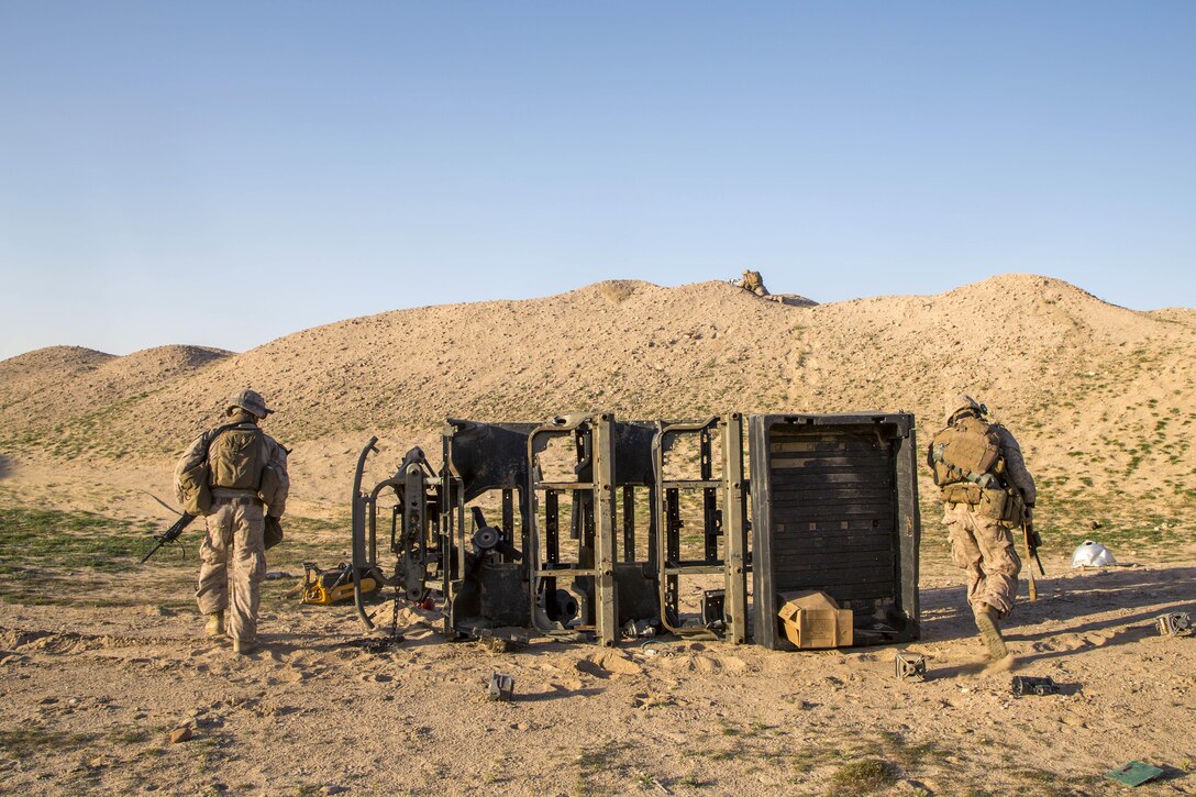 Marines observe a sensitive site during a tactical exercise to recover aircraft and personnel at an undisclosed location in Southwest Asia, Jan. 25, 2016. Marine Corps photo by Cpl. Akeel Austin
