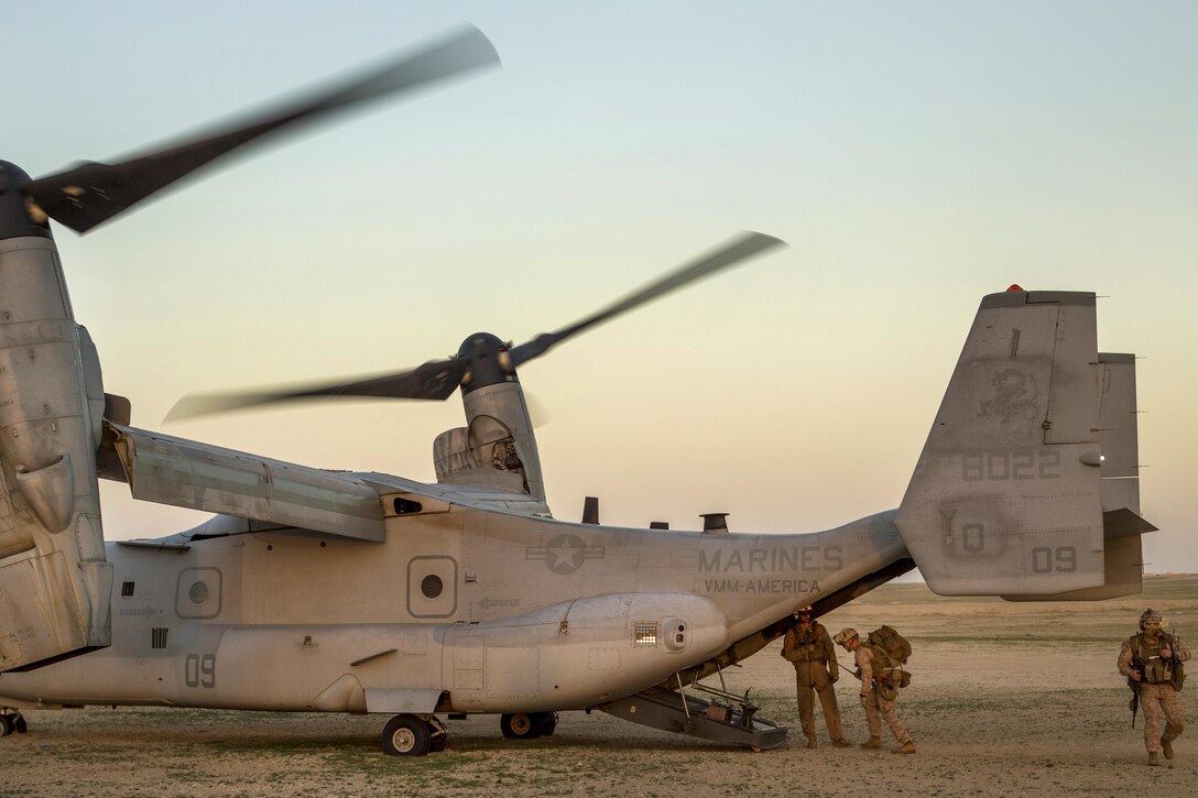 Marines board an MV-22 Osprey during a tactical exercise to recover aircraft and personnel at an undisclosed location in Southwest Asia, Jan. 25, 2016. Marine Corps photo by Cpl. Akeel Austin