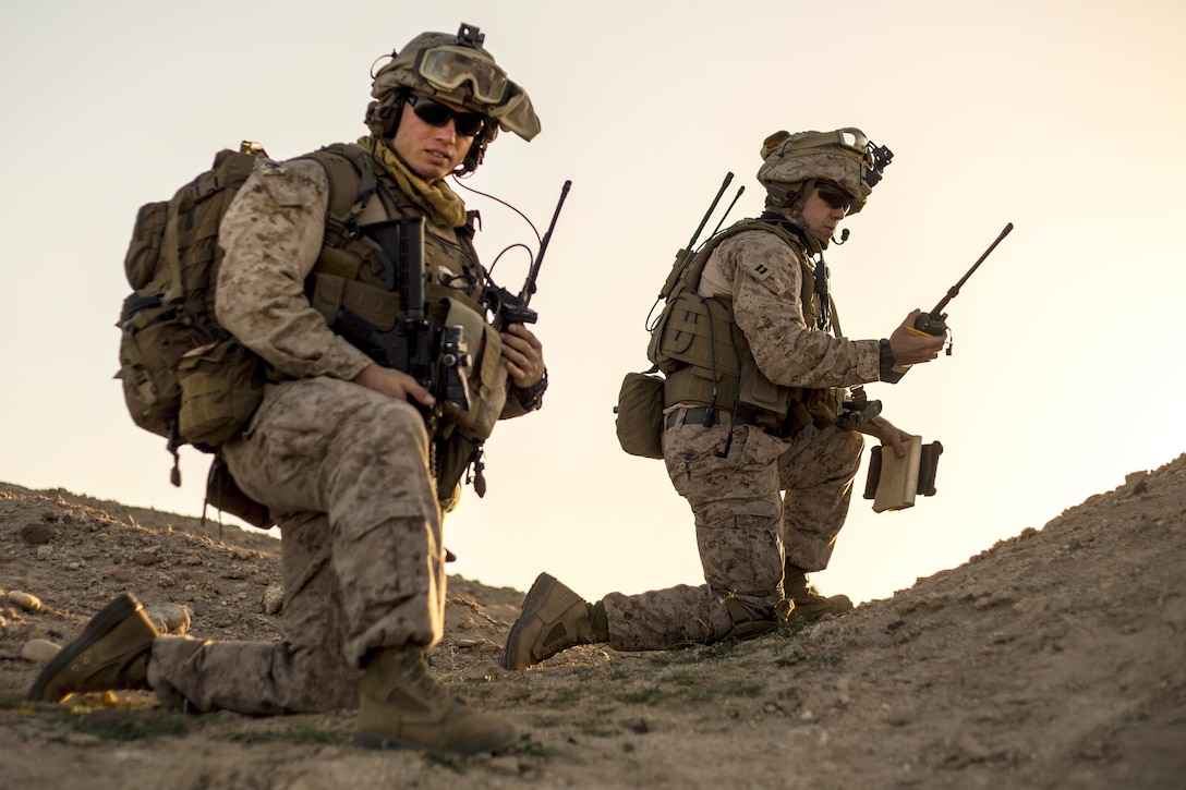 Marine Corps Staff Sgt. Alexander Oogjen, left, platoon sergeant, and Marine Corps Capt. Alexander Smith await orders during a tactical exercise to recover aircraft and personnel at an undisclosed location in Southwest Asia, Jan. 26, 2016. Oogjen, a platoon sergeant, and Smith, a forward air controller, are assigned to Charlie Company, 1st Battalion, 7th Marine Regiment, Special Purpose Marine Air-Ground Task Force Crisis Response Central Command. Marine Corps photo by Cpl. Akeel Austin