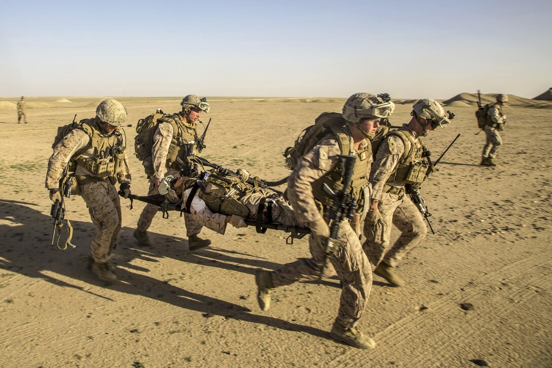 Marines transport a simulated casualty during a tactical exercise to recover aircraft and personnel at an undisclosed location in Southwest Asia, Jan. 26, 2016. Marine Corps photo by Cpl. Akeel Austin