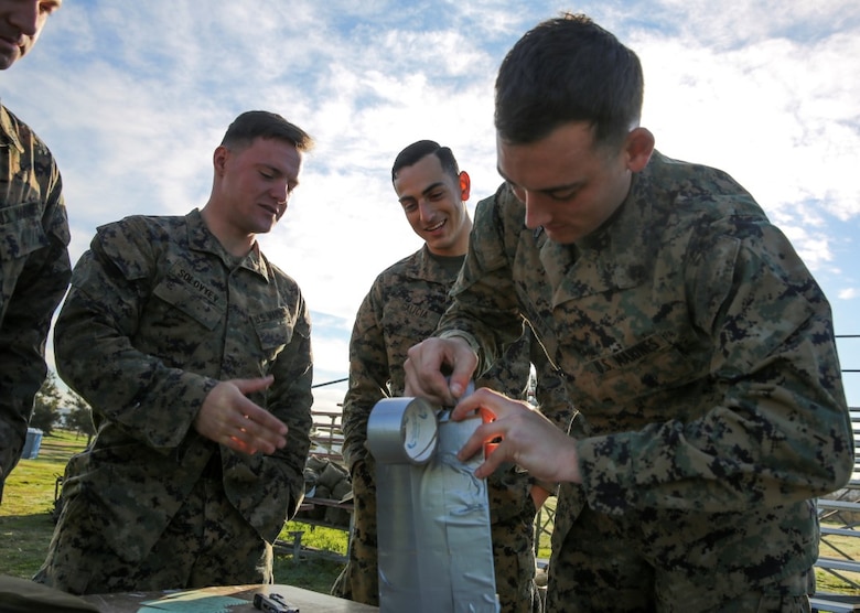 MARINE CORPS BASE CAMP PENDLETON, Calif. – Marines construct an explosive charge for breaching buildings during an urban leaders course, Jan. 29, 2016. During the course, Marines learned four different types of charges used to make a safe entrance into an objective. This type of training allows Marines to practice for possible scenarios when they are deployed to combat zones anywhere on the globe. An instructor with 1st Combat Engineer Battalion, 1st Marine Division, taught this portion of the course to infantrymen of 1st MarDiv. (U.S. Marine Corps photo by Pvt. Robert Bliss)