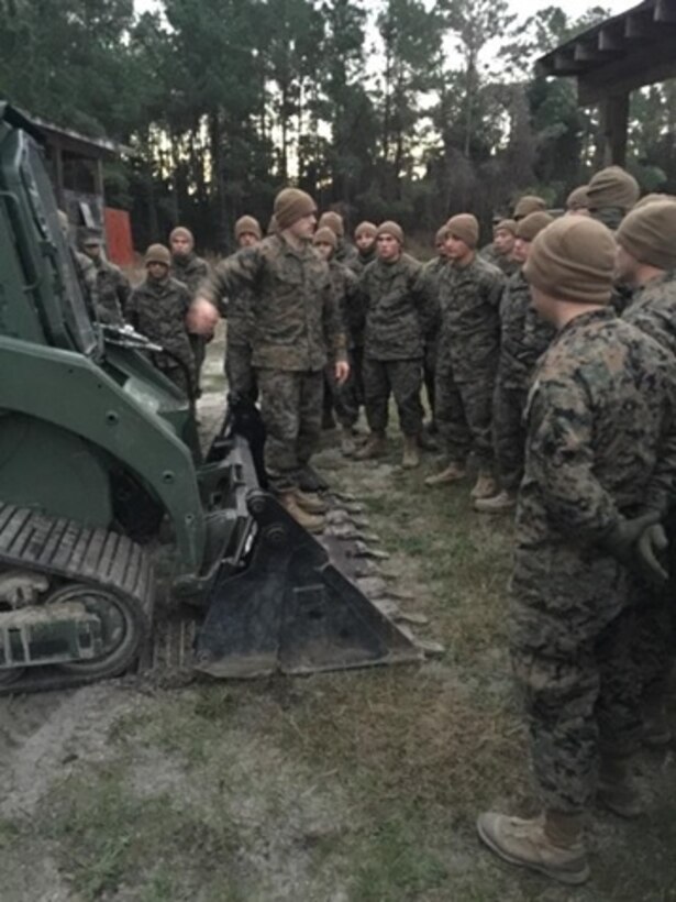 Marines attached to the Basic Combat Engineer course 10-16 (BCE 10-16) learn about the capabilities of the Multi Terrain Loader and the Airfield Damage Repair Kit, at Marine Corps Engineer School, Camp Lejeune, N.C.
