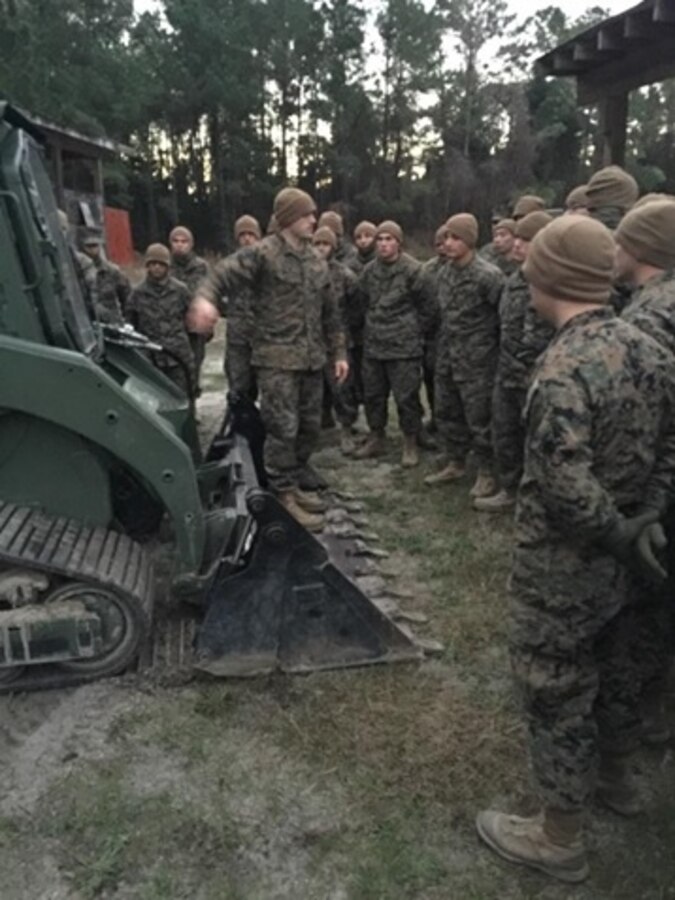 Marines attached to the Basic Combat Engineer course 10-16 (BCE 10-16) learn about the capabilities of the Multi Terrain Loader and the Airfield Damage Repair Kit, at Marine Corps Engineer School, Camp Lejeune, N.C.
