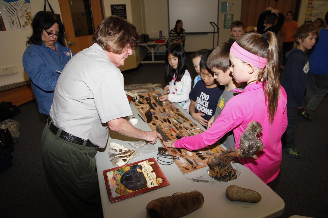 Joan Gardner and Park Ranger Claudia Hixson explain the items displayed during the Corps of Discovery presentation.
