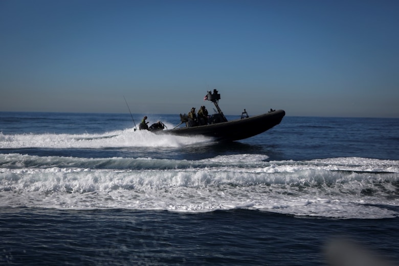 Marines assigned to Company A, 1st Reconnaissance Battalion, 1st Marine Division, and Sailors with Assault Craft Unit One, Naval Beach Group One, maneuver rigid-hulled inflatable boats out of the Dana Landing Marina to conduct dive operations training, Jan. 28, 2016. The Marines and Sailors will use their dive ability to give the 11th Marine Expeditionary Unit a valuable underwater search tool when it deploys later this year.