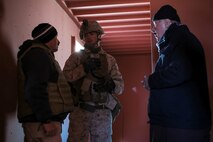 U.S. Marines with 3rd Battalion, 3rd Marine Regiment, 3rd Marine Division, obtain biometrics from civilians during an urban assault during Integrated Training Exercise 2-16 at Marine Corps Air Ground Combat Center Twentynine Palms, Calif., Jan. 26, 2016. The training was conducted to strengthen unit coordination and maneuvers during urban terrain assaults. (U.S. Marine Corps photo by Cpl. Trever A. Statz/Released)