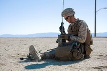 U.S. Marine Corps Cpl. Chris Godinich, an intelligence analyst with Headquarters Company, 3rd Battalion, 3rd Marine Regiment, 3rd Marine Division, calls for a simulated casualty evacuation during an urban terrain assault during Integrated Training Exercise 2-16 at Marine Corps Air Ground Combat Center Twentynine Palms, Calif., Jan. 26, 2016. The training was conducted to strengthen unit coordination and maneuvers during urban terrain assaults. (U.S. Marine Corps photo by Cpl. Trever A. Statz/Released)