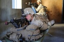 U.S. Marine Corps Lance Cpl. Curtis Fletcher, a team leader with 3rd Battalion, 3rd Marine Regiment, 3rd Marine Division, provides security during a simulated urban terrain assault during Integrated Training Exercise 2-16 at Marine Corps Air Ground Combat Center Twentynine Palms, Calif., Jan. 26, 2016. The training was conducted to strengthen unit coordination and maneuvers during urban terrain assaults. (U.S. Marine Corps photo by Cpl. Trever A. Statz/Released)