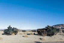 U.S. Marines with 3rd Battalion, 3rd Marine Regiment, 3rd Marine Division, move into an offensive position in amphibious assault vehicles to conduct a simulated urban assault during Integrated Training Exercise 2-16 at Marine Corps Air Ground Combat Center Twentynine Palms, Calif., Jan. 26, 2016. The training was conducted to strengthen unit coordination and maneuvers during urban terrain assaults. (U.S. Marine Corps photo by Cpl. Trever A. Statz/Released)