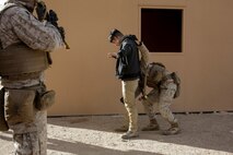 U.S. Marines with 3rd Battalion, 3rd Marine Regiment, 3rd Marine Division, search residents during urban defensive training during Integrated Training Exercise 2-16 at Marine Corps Air Ground Combat Center Twentynine Palms, Calif., Jan. 29, 2016. The training was conducted to strengthen unit coordination and maneuvers during urban terrain assaults. (U.S. Marine Corps photo by Cpl. Trever A. Statz/Released)