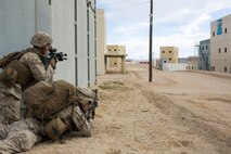 U.S. Marines with 3rd Battalion, 3rd Marine Regiment, 3rd Marine Division, provide security during urban defensive training during Integrated Training Exercise 2-16 at Marine Corps Air Ground Combat Center Twentynine Palms, Calif., Jan. 29, 2016. The training was conducted to strengthen unit coordination and maneuvers during urban terrain assaults. (U.S. Marine Corps photo by Cpl. Trever A. Statz/Released)