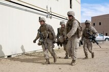 U.S. Marines with 3rd Battalion, 3rd Marine Regiment, 3rd Marine Division, carry a simulated casualty during urban defensive training during Integrated Training Exercise 2-16 at Marine Corps Air Ground Combat Center Twentynine Palms, Calif., Jan. 29, 2016. The training was conducted to strengthen unit coordination and maneuvers during urban terrain assaults. (U.S. Marine Corps photo by Cpl. Trever A. Statz/Released)