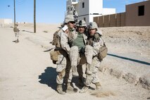 U.S. Marines with 3rd Battalion, 3rd Marine Regiment, 3rd Marine Division, carry a simulated casualty during urban defensive training during Integrated Training Exercise 2-16 at Marine Corps Air Ground Combat Center Twentynine Palms, Calif., Jan. 29, 2016. The training was conducted to strengthen unit coordination and maneuvers during urban terrain assaults. (U.S. Marine Corps photo by Cpl. Trever A. Statz/Released)