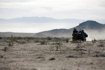 U.S. Marines with 2nd Battalion, 7th Marine Regiment, 1st Marine Division, move into position in an amphibious assault vehicle during a mechanized assault course during Integrated Training Exercise 2-16 at Marine Corps Air Ground Combat Center Twentynine Palms, Calif., Jan. 28, 2016. The training was one of a series of evolutions that will take place during ITX 2-16, a Marine Air Ground Task Force sized training event led by the 5th Marine Regiment, which will forward deploy later this year with various elements to create the Special Purpose Marine Air Ground Task Force Crisis Response Central Command 16.2. (U.S. Marine Corps photo by Cpl. Trever A. Statz/Released)