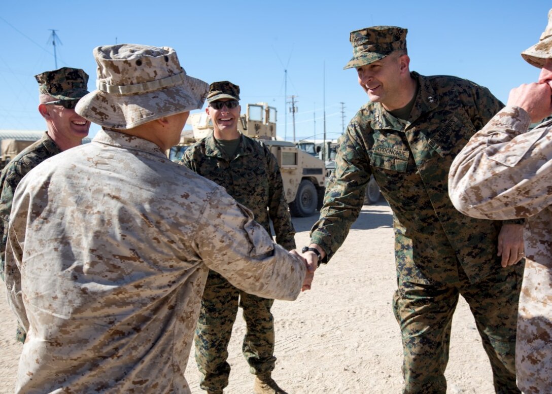 U.S. Marine Corps Maj. Gen. Daniel O'Donohue, the commanding general of 1st Marine Division, shakes hands with Sgt. Maj. Chuong Nguyen, 5th Marine Regiment Sergeant Major, during Integrated Training Exercise 2-16 at Marine Corps Air Ground Combat Center Twentynine Palms, Calif., Jan. 28, 2016. Maj. Gen. O'Donohue visited the 1st MARDIV units participating in ITX 2-16. (U.S. Marine Corps photo by Cpl. Trever A. Statz/Released)