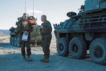 U.S. Marine Corps Maj. Gen. Daniel O'Donohue, commanding general of 1st Marine Division, talks to Col. Jeffrey Tuggle, Assistant Chief of Staff G-3 of 1st MARDIV, before a mechanized assault course during Integrated Training Exercise 2-16 at Marine Corps Air Ground Combat Center Twentynine Palms, Calif., Jan. 28, 2016. Maj. Gen. O'Donohue visited the 1st MARDIV units participating in ITX 2-16. (U.S. Marine Corps photo by Cpl. Trever A. Statz/Released)