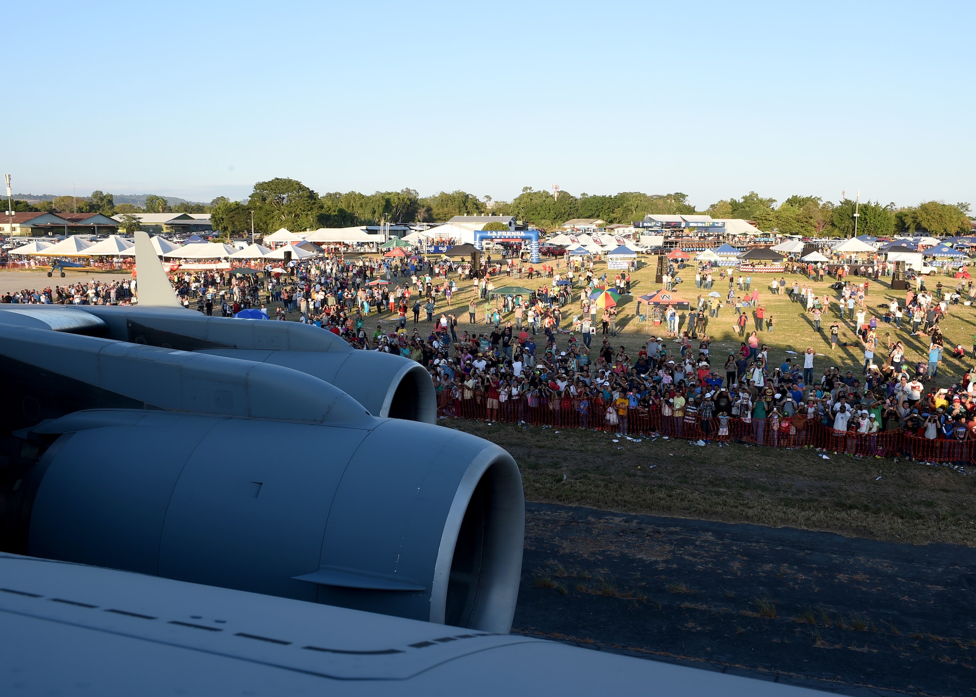 Citizens of El Salvador watch as a U.S. Air Force C-17 Globemaster III cargo aircraft, 58th Airlift Squadron is being taxied prior to takeoff at Ilopango International Airport in San Salvador, El Savador, Jan. 31, during the 2016 Ilopango Airshow. The C-17 was sent from Altus Air Force Base, Okla., to foster relationships between the U.S. and El Salvador. The aircraft was setup as a static display for the attendees to view and learn about some of its capabilities. (U.S. Air Force photo by Senior Airman Franklin R. Ramos/Released)