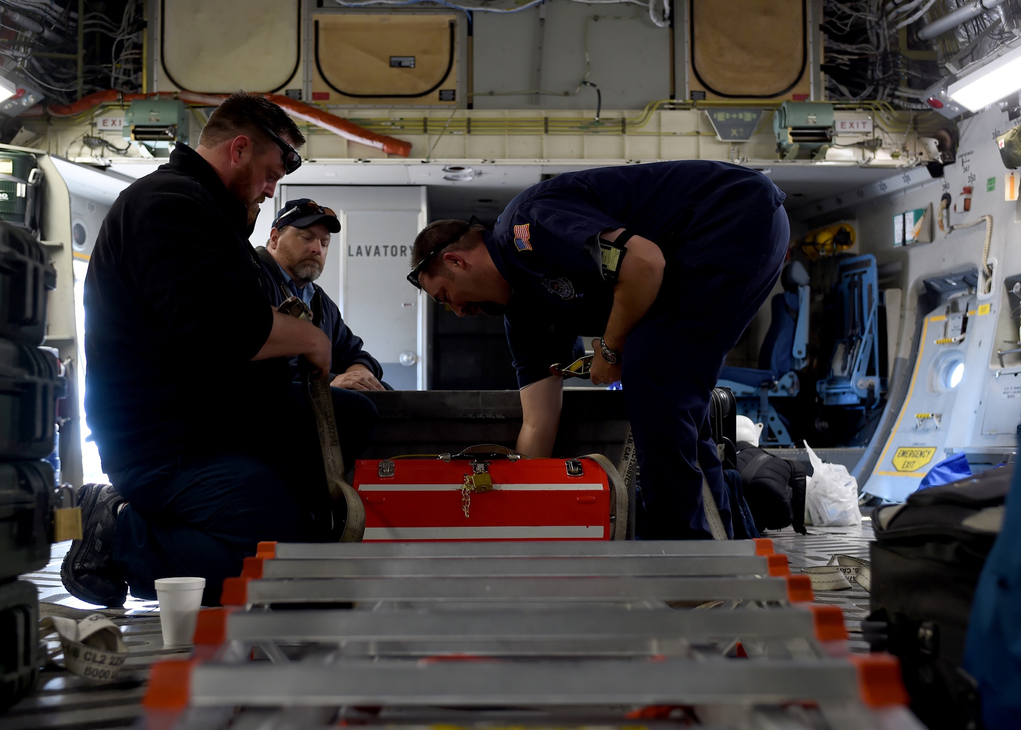 Maintainers from the 97th Maintenance Directorate, load tool boxes onto a U.S. Air Force C-17 Globemaster III cargo aircraft from the 58th Airlift Squadron, Jan. 29, 2016 at Altus Air Force Base, Okla. The C-17 and its crew prepared for a weekend trip to participate in the 2016 Ilopango Airshow in San Salvador, El Salvador from Jan. 30 - 31. (U.S. Air Force photo by Senior Airman Franklin R. Ramos/Released)