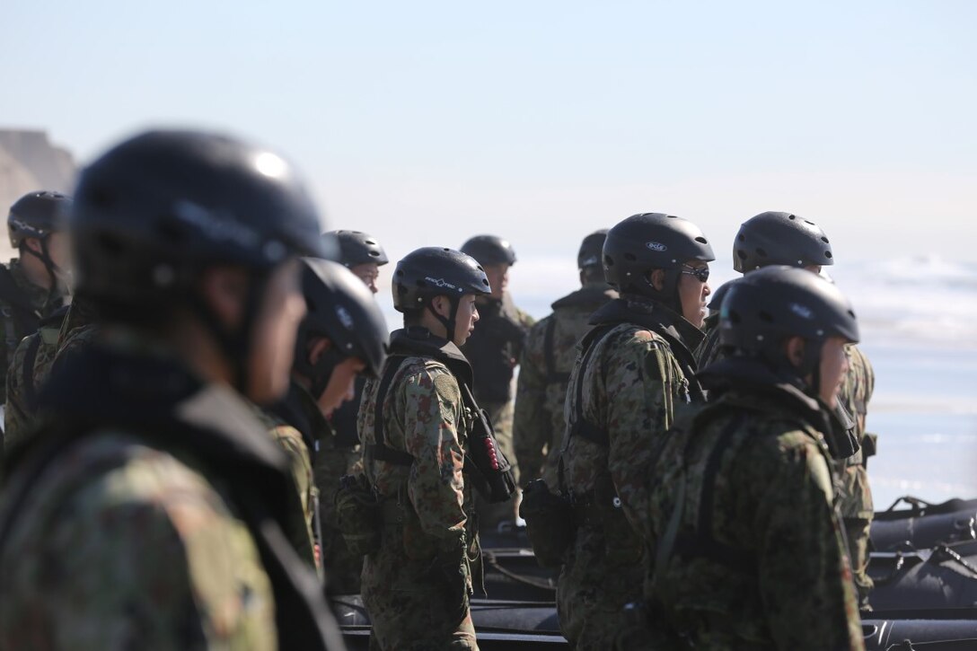 Soldiers of the Japan Ground Self-Defense Force’s Western Army Infantry Regiment stand by their boats in preparation to begin the combat rubber raiding craft evolution of Exercise Iron Fist 2016 on Marine Corps Base Camp Pendleton, Calif., Jan. 28. Iron Fist is an annual, bilateral training event building up to a scenario-based amphibious assault launching from the USS Somerset in late February. (U.S. Marine Corps photo by Lance Cpl. Timothy Valero/ Released)