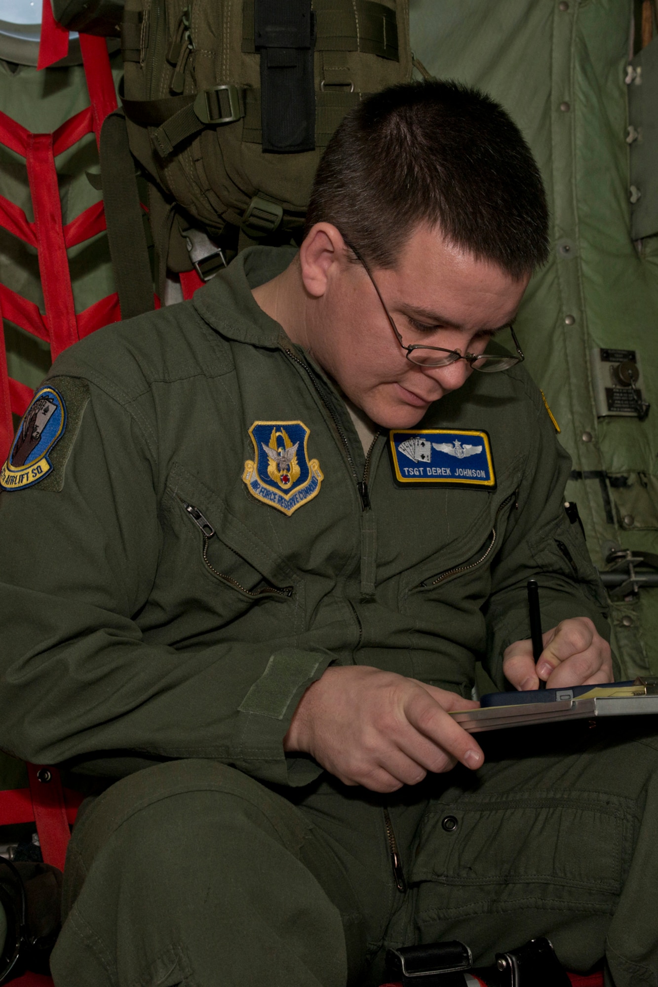 U.S. Air Force Reserve Tech. Sgt. Derek Johnson, a loadmaster assigned to the 327th Airlift Squadron, calculates the weight and balance of the C-130H before its final training mission flight at Little Rock Air Force Base, Ark., Jan. 28, 2016. The flight marks the official change of mission from the “H” model to the “J” model for the 913th Airlift Group. (U.S. Air Force photo by Master Sgt. Jeff Walston/Released)
