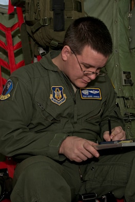 U.S. Air Force Reserve Tech. Sgt. Derek Johnson, a loadmaster assigned to the 327th Airlift Squadron, calculates the weight and balance of the C-130H before its final training mission flight at Little Rock Air Force Base, Ark., Jan. 28, 2016. The flight marks the official change of mission from the “H” model to the “J” model for the 913th Airlift Group. (U.S. Air Force photo by Master Sgt. Jeff Walston/Released)