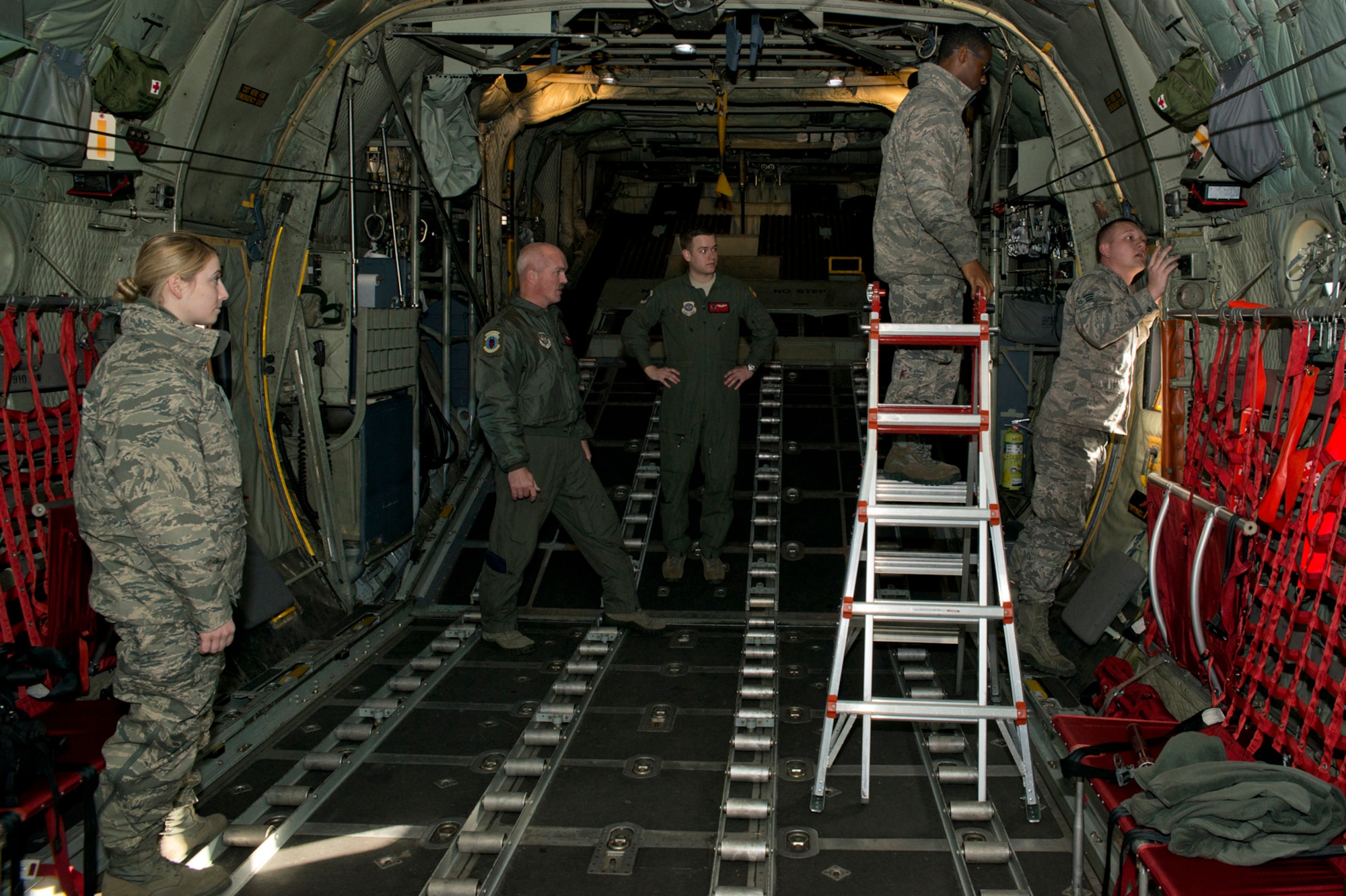 U.S. Air Force Reserve Airmen assigned to the 913th Maintenance Squadron work on a C-130H before its final training mission flight at Little Rock Air Force Base, Ark., Jan. 28, 2016. The flight marks the official change of mission from the “H” model to the “J” model for the 913th Airlift Group. (U.S. Air Force photo by Master Sgt. Jeff Walston/Released)
