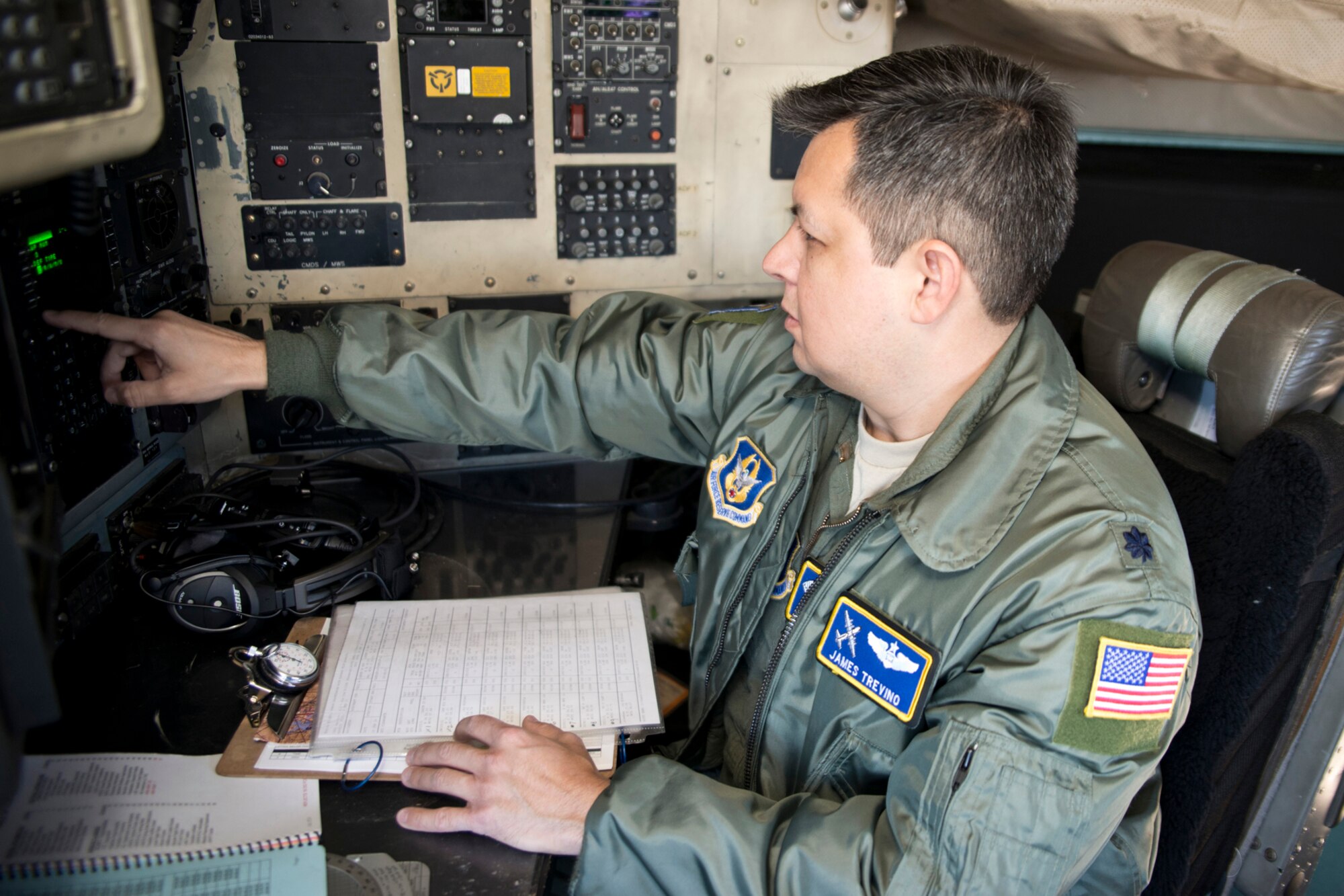 U.S. Air Force Reserve Lt. Col. James Trevino, a master navigator assigned to the 327th Airlift Squadron, performs preflight checklist before a training mission at Little Rock Air Force Base, Ark., Jan. 28, 2016. The final two-hour mission consisted of low level air drop techniques and pilot proficiency training. (U.S. Air Force photo by Master Sgt. Jeff Walston/Released)  