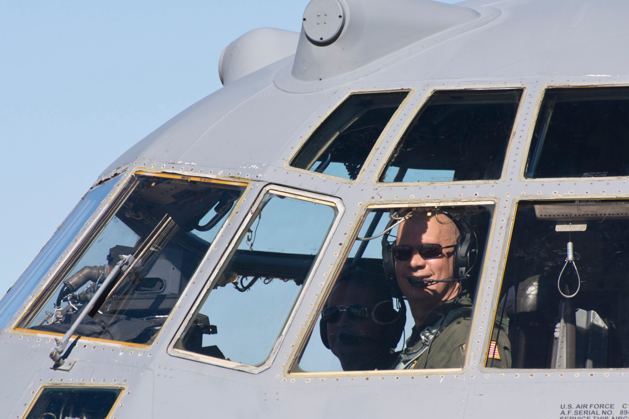 U.S. Air Force Reserve Lt. Cols. Neil Hede (Right) and Keith Jasmin, pilots assigned to the 327th Airlift Squadron, smile after completing the last training mission flight of a C-130H at Little Rock Air Force Base, Ark., Jan. 28, 2016. The final two-hour mission consisted of low level air drop techniques and pilot proficiency training. (U.S. Air Force photo by Master Sgt. Jeff Walston/Released)