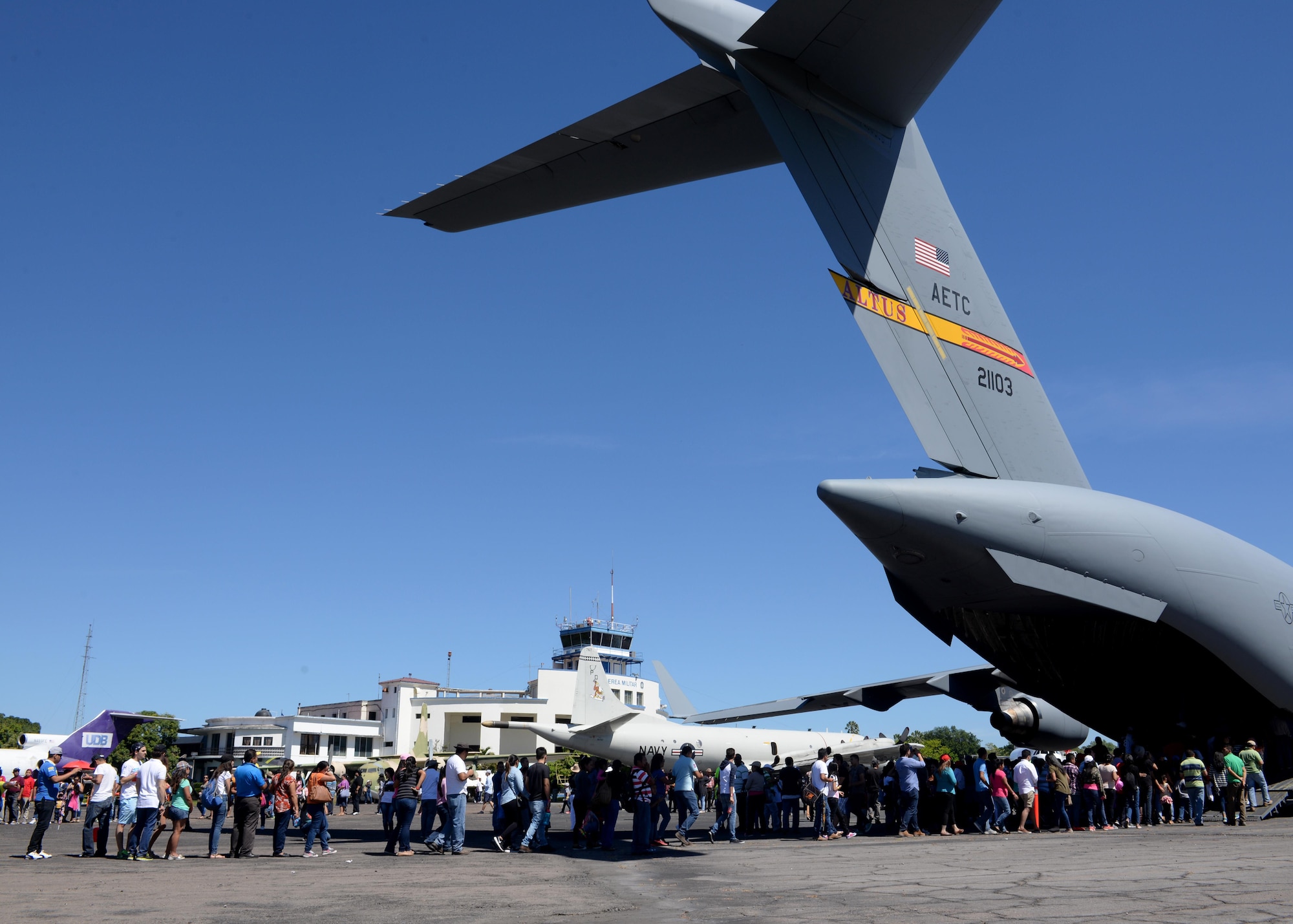 Citizens from El Salvador, line up to enter a U.S. Air Force C-17 Globemaster III cargo aircraft, 58th Airlift Squadron, at Ilopango International Airport in San Salvador, El Savador, Jan. 30, during the 2016 Ilopango Airshow. The C-17 was sent from Altus Air Force Base, Okla., to foster relationships between the U.S. and El Salvador. The aircraft was setup as a static display for the attendees to view and learn about some of its capabilities. (U.S. Air Force photo by Senior Airman Franklin R. Ramos/Released)
