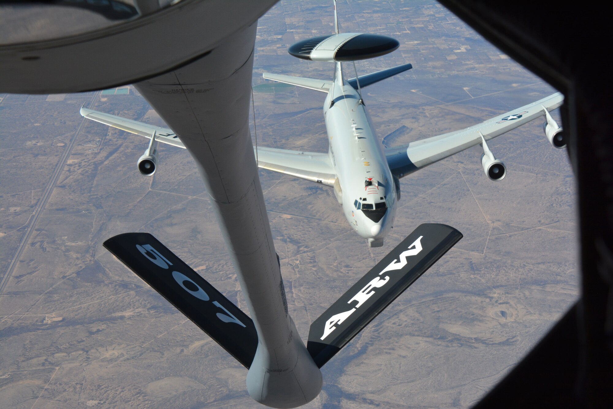 An Air Force Reserve Command KC-135R Stratotanker refueling boom moves into position to conduct an aerial refueling with an E-3 Airborne Warning and Control System aircraft over Texas during a Congressional orientation flight, Jan. 19, 2016. (U.S. Air Force photo/Maj. Jon Quinlan) 
