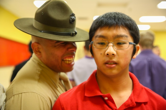 Sergeant Lewis A. Velasquez, drill instructor, Receiving Company, Support Battalion, instructs a recruit to respond louder during receiving at Marine Corps Recruit Depot San Diego, Feb. 1. Recruits must respond to everything a drill instructor says to develop instant obedience to orders. During the recruits’ first hours of recruit training, they will get haircuts, receive their initial gear issue and be searched for any contraband. Annually, more than 17,000 males recruited from the Western Recruiting Region are trained at MCRD San Diego. Golf Company is scheduled to graduate April 29.