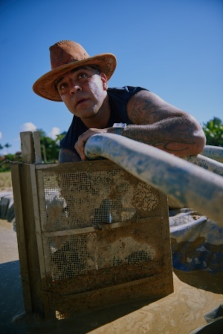 U.S. Army Sgt. 1st Class Benito Segura, Defense POW/MIA Accounting Agency (DPAA) team sergeant, checks pipes leading to a wet screening station during excavation operations in Dien Bien province, Vietnam, Nov. 21, 2015. Segura is deployed as part of a recovery team in the search of two crew members of an F-4C aircraft lost during the Vietnam War. DPAA deploys teams from its operational office based at Joint Base Pearl Harbor-Hickam in Hawaii to provide the fullest possible accounting of missing personnel to their families and the nation. (DoD photo by Staff Sgt. Kathrine Dodd, USAF/RELEASED)