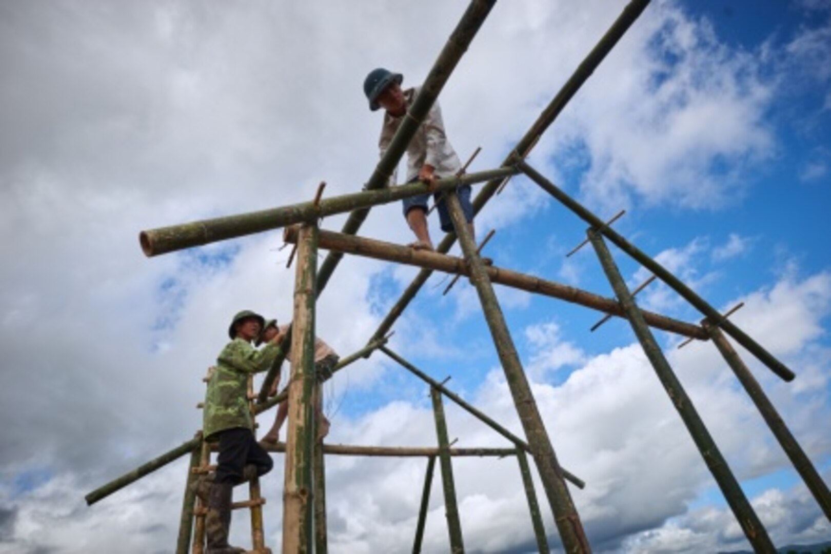 Local workers secure frames for a wet screening station at a site that will be excavated by a recovery team from the Defense POW/MIA Accounting Agency, Dien Bien province, Vietnam, Nov. 13, 2015. The DPAA mission is to provide the fullest possible accounting for our missing personnel to their families and the nation. (DoD photo by Staff Sgt. Kathrine Dodd, USAF/RELEASED)