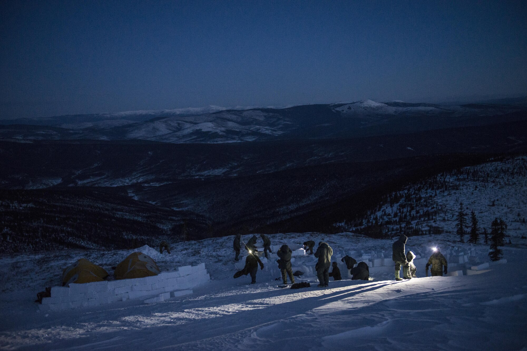 Students prepare to build an igloo during Survival Evasion Resistance Escape (S.E.R.E) 5-level training Jan 21, 2016, in the Joint Pacific Alaska Range Complex. The Arctic survival training is a weeklong course that gives the S.E.R.E. specialist hands on experience with building shelters and surviving the extreme temperatures of the arctic. (U.S. Air Force photo by Staff Sgt. Joshua Turner/Released) 