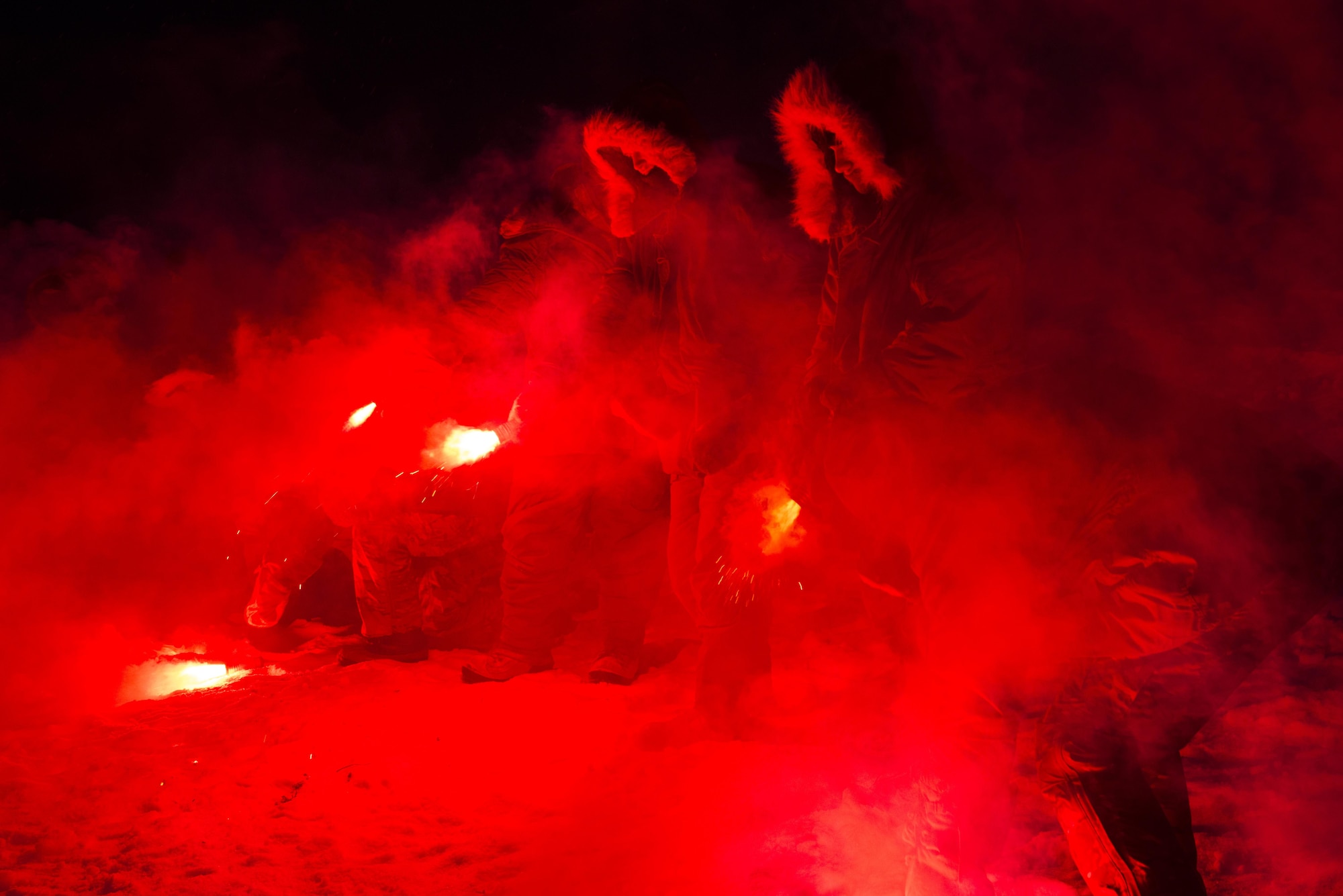 Students ignite an Mk 124 during Survival Evasion Resistance Escape (S.E.R.E) 5-level training Jan 22, 2016, in the Joint Pacific Alaska Range Complex. The Arctic survival training is a weeklong course that gives the S.E.R.E. specialist hands on experience with building shelters and surviving the extreme temperatures of the arctic. (U.S. Air Force photo by Staff Sgt. Joshua Turner/Released)