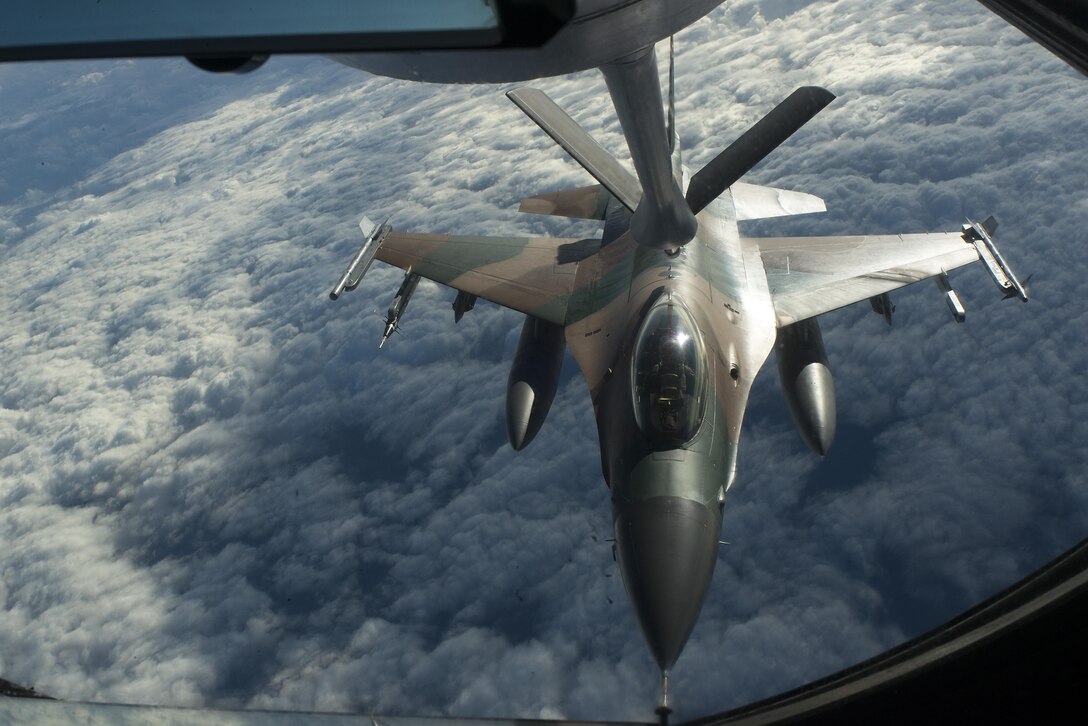 A U.S. Air Force F-16 Fighting Falcon from the 18th Aggressor Squadron refuels from a KC-135 Stratotanker during Forceful Tiger Jan. 28, 2016, near Okinawa, Japan. The 18th AGRS, stationed at Eielson Air Force Base, Alaska, recently deployed to Kadena Air Base, Japan, for joint and bilateral training to bolster mission readiness in the Indo-Asia-Pacific region. (U.S. Air Force photo by Staff Sgt. Maeson L. Elleman/Released)