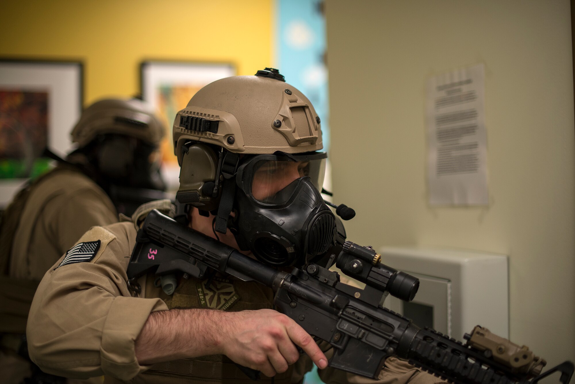 U.S. Air Force Staff Sgt. Matthew Roush, 23d Security Forces Squadron combat arms training and maintenance instructor, secures a hallway as his team members clear a room, Jan. 28, 2016, at Moody Air Force Base, Ga. The members of the SRT worked on clearing procedures to train for their responsibilities, which could include intervening in hostage situations, providing security for distinguished visitors or high-risk arrests. (U.S. Air Force photo by Tech. Sgt. Zachary Wolf/Released)