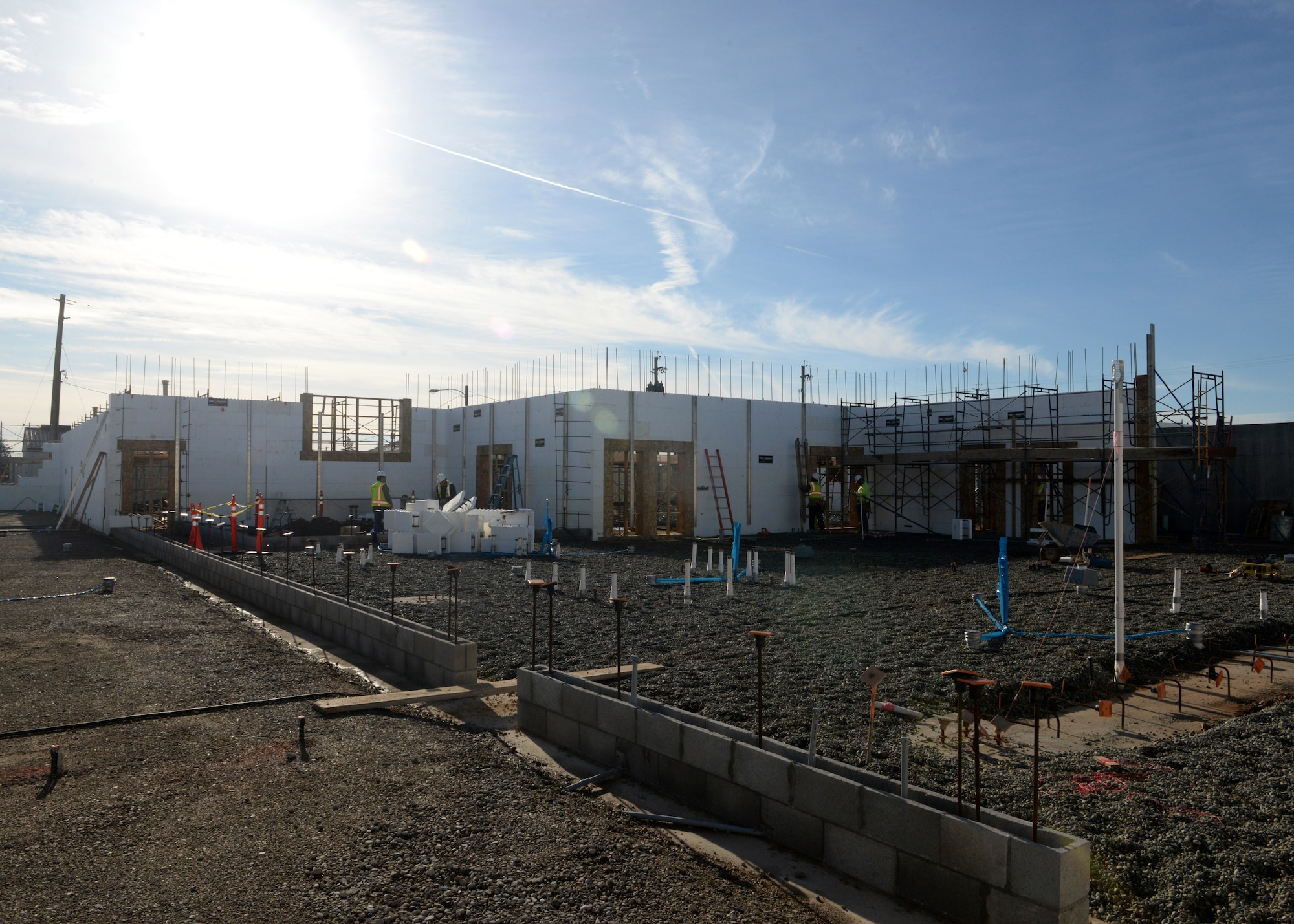 The 9th Civil Engineer Squadron’s Administration and Operations Facility is in the progress of construction on Jan. 27, 2016, at Beale Air Force Base, California. The contractors are erecting walls using insulated concrete forms designed to be energy efficient.  The facility is a replacement of the last, which was lost in a fire in January 2013. (U.S. Air Force photo by Senior Airman Ramon A. Adelan) 