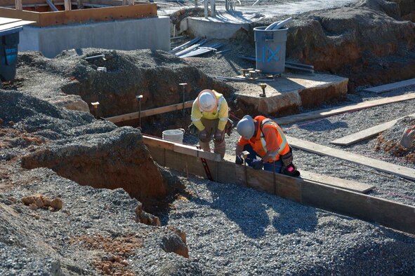 Construction workers layout concrete forms at the 548th Intelligence, Surveillance, and Reconnaissance Group’s Distribution Common Ground System project site Jan. 27, 2016, at Beale Air Force Base, California. The DCGS will work in conjunction with other ISR assets to meet the demand for time-critical processing, exploitation, and dissemination of actionable intelligence data in support of combat operations, as well as the ability to support contingencies worldwide and integrate new ISR technologies as they are operationally fielded. (U.S. Air Force photo by Sean Beermann)