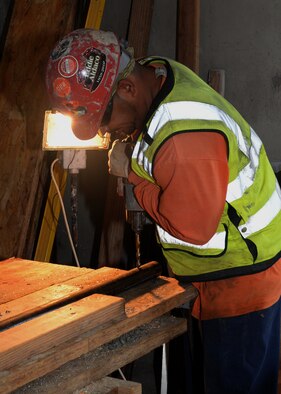 A construction worker drills into a pipe during the building of the 9th Civil Engineer Squadron’s Administration and Operations Facility Jan. 27, 2016, at Beale Air Force Base, California. Construction began on the structure April 2015 and is slated to be complete by the summer of 2016. The facility is a replacement of the last, which was lost in a fire in January 2013. (U.S. Air Force photo by Senior Airman Ramon A. Adelan)