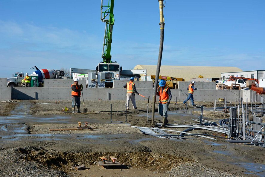 A construction crew pours concrete at the 548th Intelligence, Surveillance, and Reconnaissance Group’s Distribution Common Ground System project site Jan. 8, 2016, at Beale Air Force Base, California. The DCGS will work in conjunction with other ISR assets to meet the demand for time-critical processing, exploitation, and dissemination of actionable intelligence data in support of combat operations. They also have the ability to support contingencies worldwide and integrate new ISR technologies as they are operationally fielded. (U.S. Air Force photo by Sean Beermann)