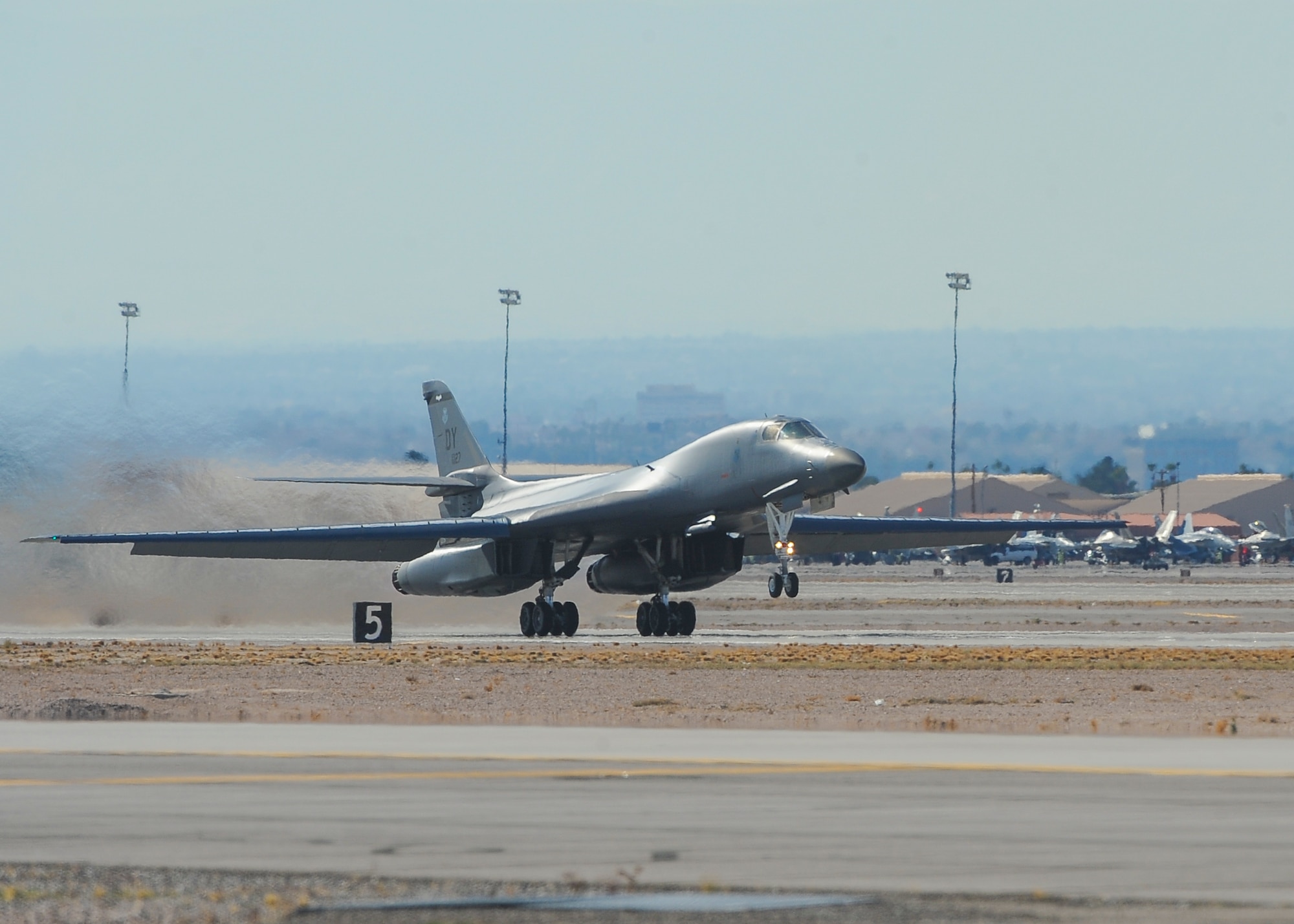 A B-1B Lancer, assigned to the 7th Bomb Wing, Dyess Air Force Base, Texas, takes off from Nellis AFB, Nev., during Red Flag 16-1 Jan. 29, 2016. The 7th BW is one of many U.S. and allied air forces the 606th Air Control Squadron from Spangdahlem Air Base, Germany, provides tactical command and control for during the three-week realistic air combat training over the 2.9 million acre Nevada Test and Training Range. (U.S. Air Force photo by Senior Airman Jake Carter)