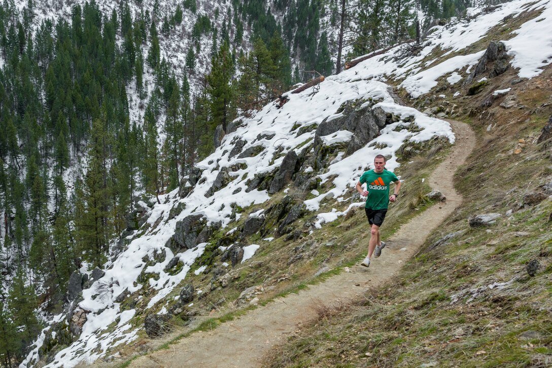 Airman Chester Mientkiewicz, 366th Public Affairs photojournalist, runs along the trail to Skinny Dipper Hot Springs, Idaho, Jan 22, 2016. Idaho’s hot springs are often tucked away on the side of a mountain and only require a short hike. (U.S. Air Force photo by Airman 1st Class Connor J. Marth/RELEASED)