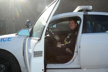 Shawn Kennedy, 22nd Security Forces Squadron supervisory police officer, poses for a photo in his squad car, Jan. 29, 2016, at McConnell Air Force Base, Kan. Kennedy received the Air Force Outstanding Security Forces Flight-Level Civilian Supervisory Level Award for excellent work within his career field, advancement in education and volunteer work within the local community (U.S. Air Force photo/Airman Jenna K. Caldwell) 